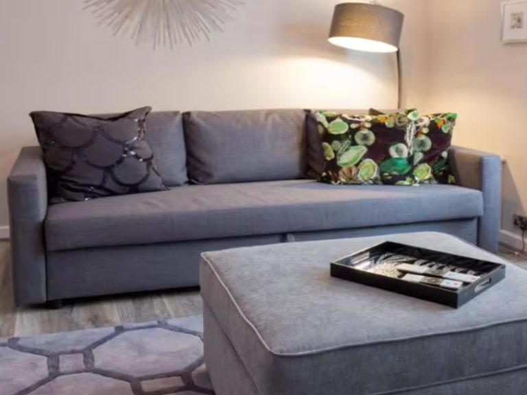 Blackbird Luxury Accommodation Suite 7 Neatly arranged bedroom with a double bed, patterned cushions, and bedside tables.